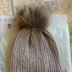 Warm women’s winter hat with faux fur Pom Pom